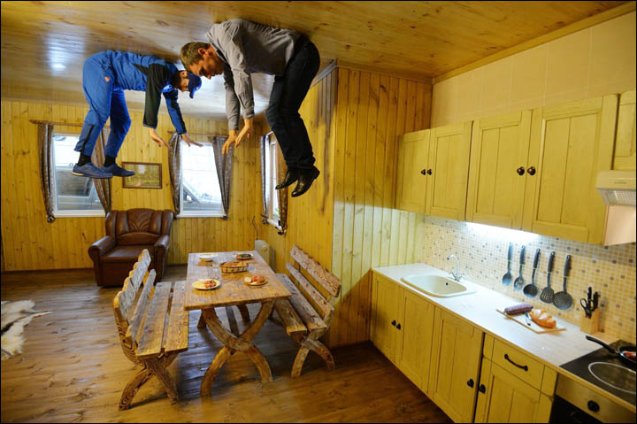 Two man in the kitchen of upside down house in Novosibirsk