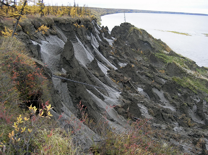 Building breaks in middle and collapses 10 metres as thawing permafrost no longer supports stilts 