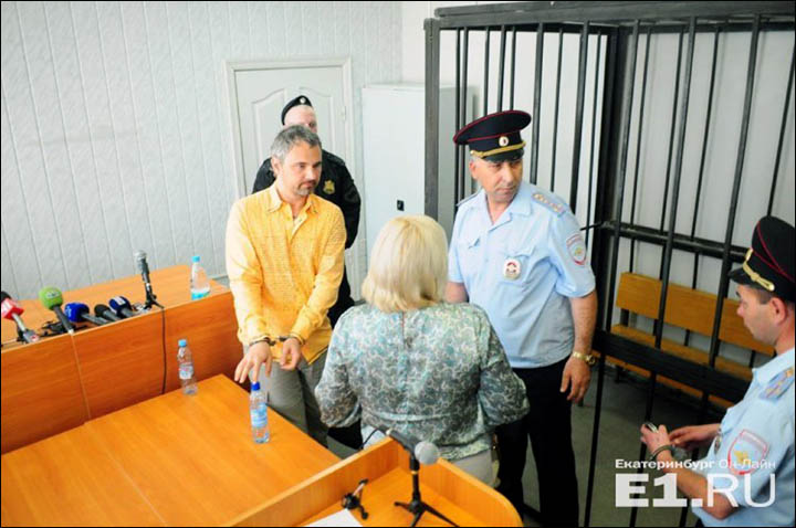 Dmitry Loshagin handcuffed