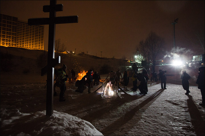 Thousands plunge into freezing waters to solemnly mark Orthodox Epiphany