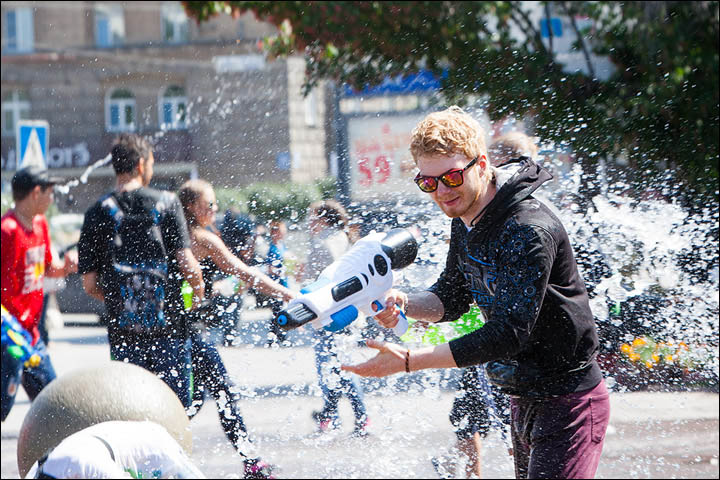 The scene resembles Songkran in Thailand when you are lucky to escape dry.