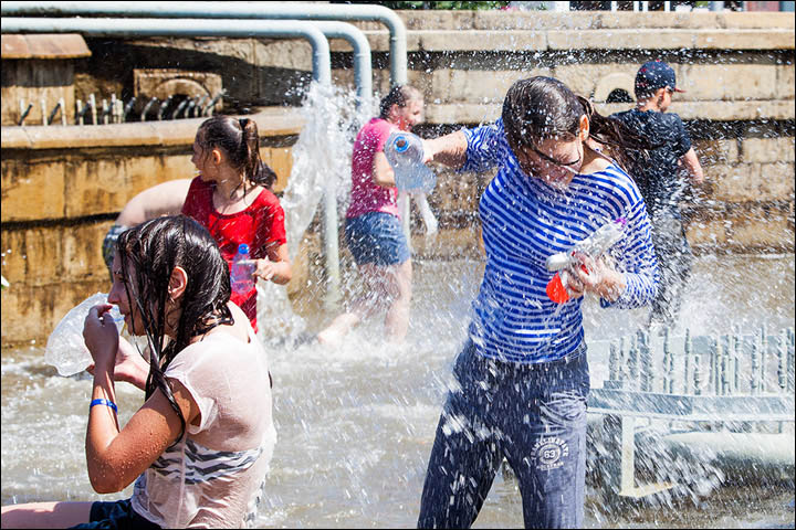 The scene resembles Songkran in Thailand when you are lucky to escape dry.