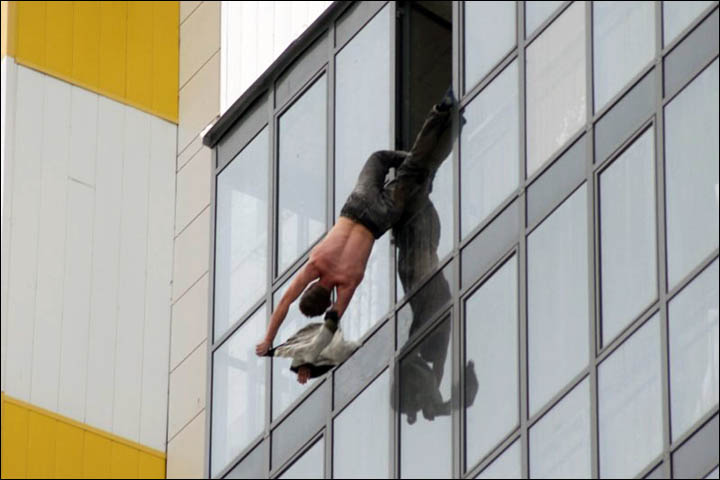 Man hanging in the window