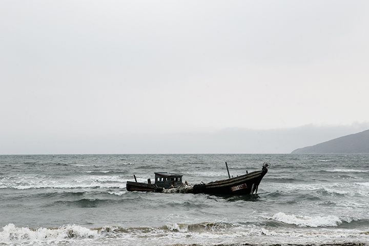 Photographer captures eerie graveyard of North Korean schooners scattered along the Russian coast