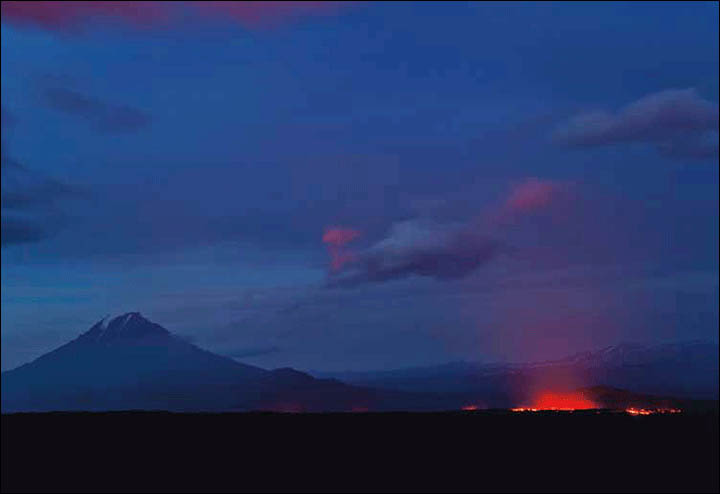 Photographer Sergei Krasnoschekov watches an volcanic eruption at Tolbachik, seen by the Soviets as the most lunar place on the planet.