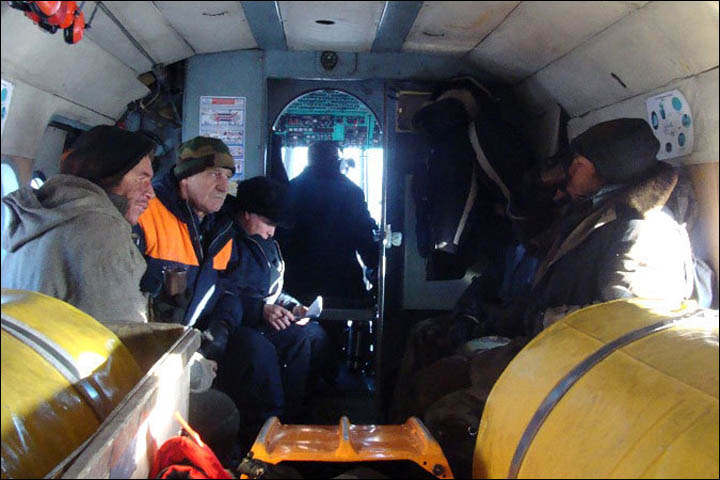 fishermen inside the helicopter