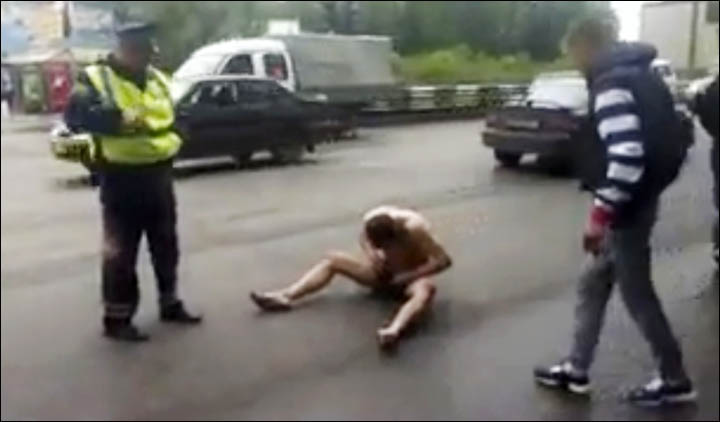 Naked man on the busy road