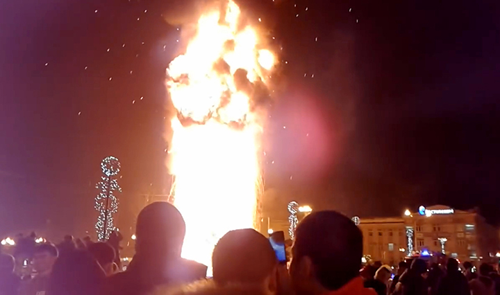 Festive tree erupts in flames as several thousand mark New Year celebration