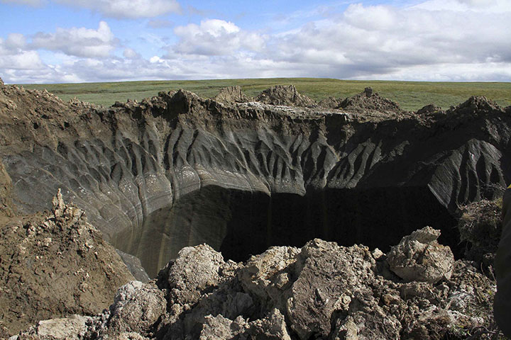 Giant new 50-metre deep crater opens up after explosion in Arctic tundra 