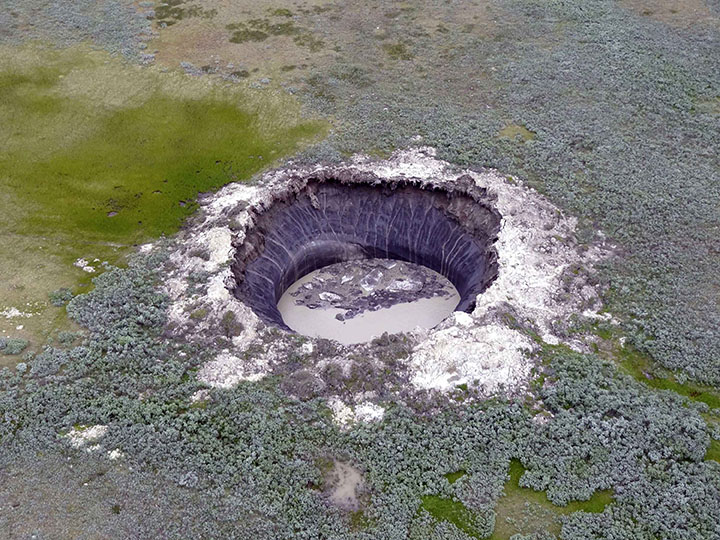 Giant new 50-metre deep crater opens up after explosion in Arctic tundra 