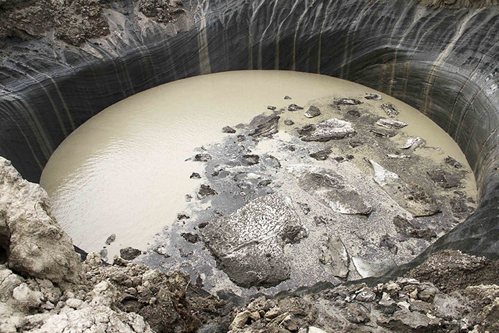 Giant new 50-metre deep crater opens up after explosion in Arctic tundra 