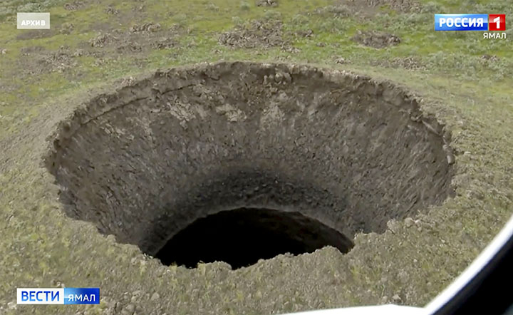 Giant new 50-metre deep crater opens up after explosion in Arctic tundra 