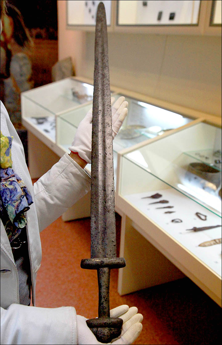 The medieval sword was discovered buried under a tree in Novosibirsk region, and scientists are keen to unlock its secrets.