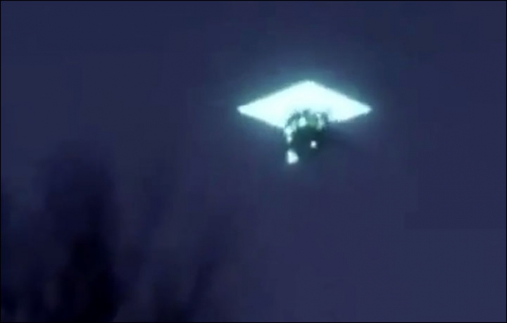 Bizarre diamond-shaped 'UFO' swallows another unidentified flying object in  the night sky
